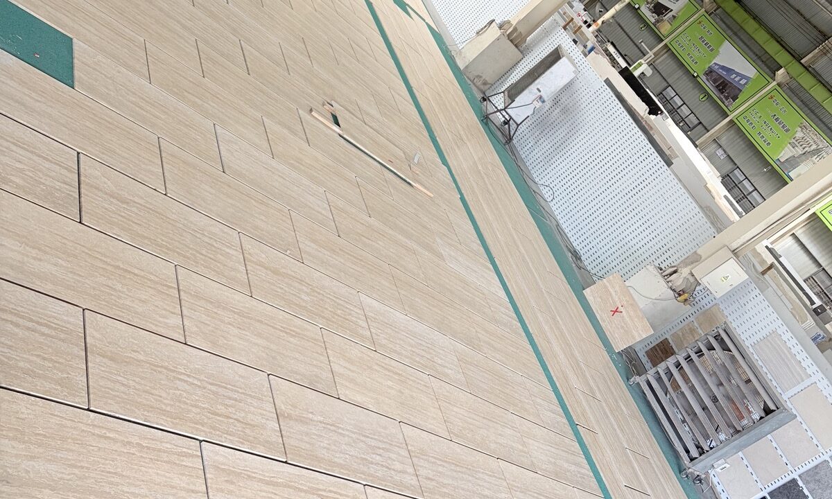 Cross-cut travertine panels arranged in a row, showing the linear movement running across each panel