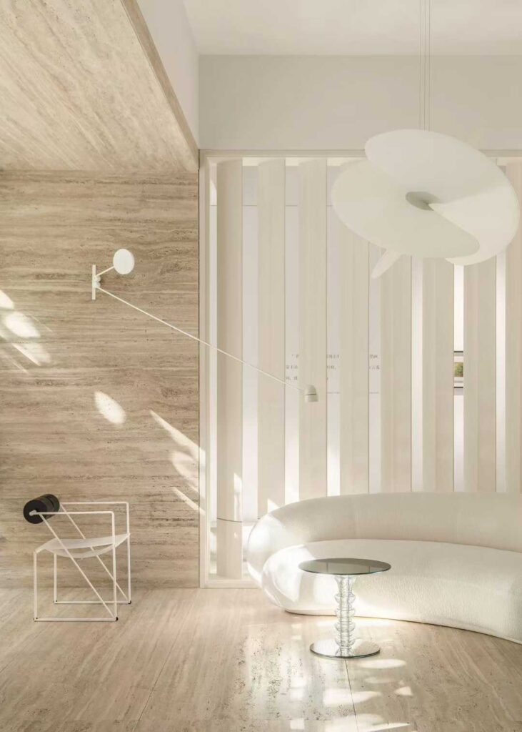 Sunlight crossing a travertine wall, showing the horizontal movement and the shadow it throws