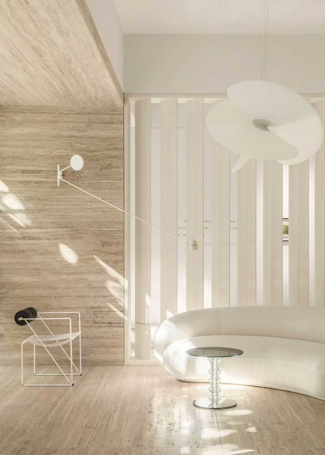 Sunlight crossing a travertine wall, showing the horizontal movement and the shadow it throws
